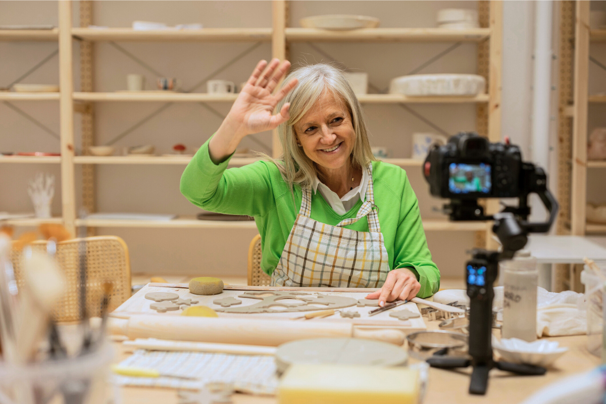 woman filming TikTok handcrafted items DIY Craft Warehouse