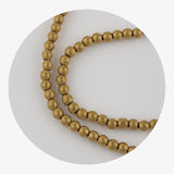 stone string beads metallic gold